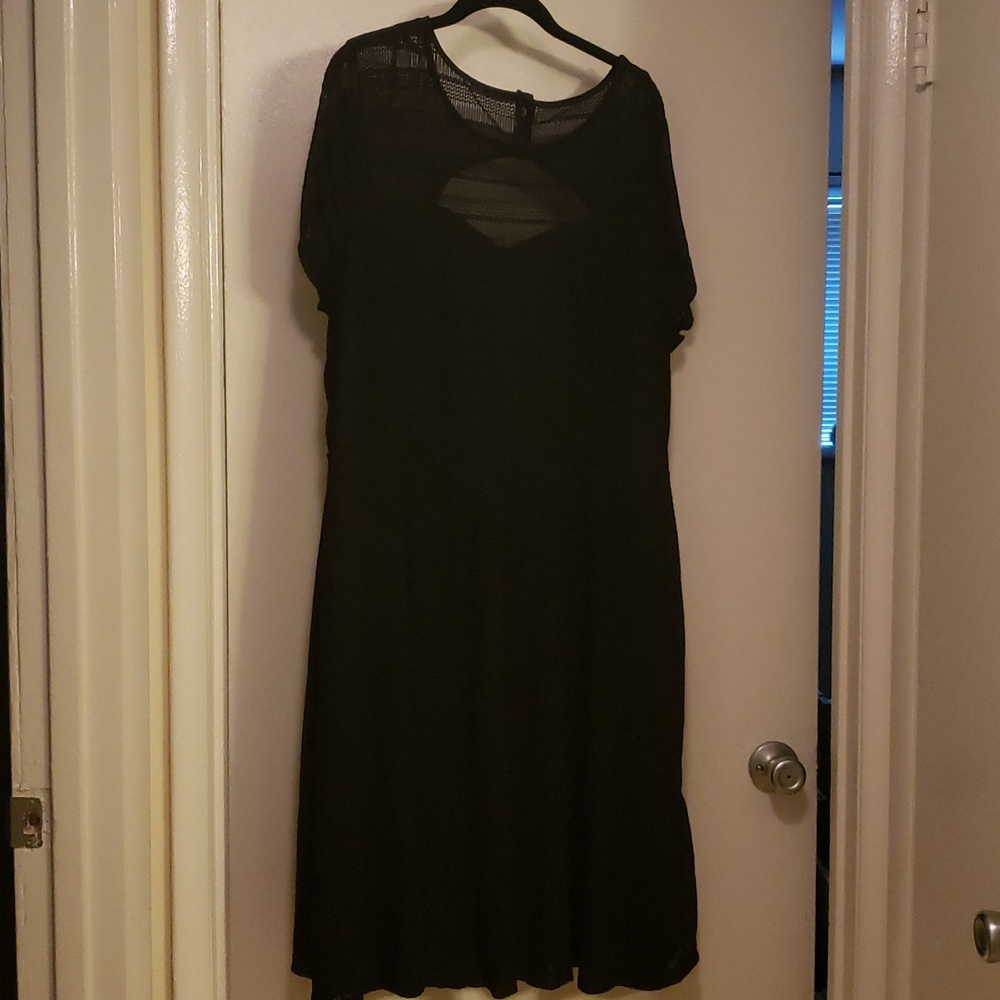 Black lace print lined dress. Short sleeve. Aline. Seam at waist. Back cut out